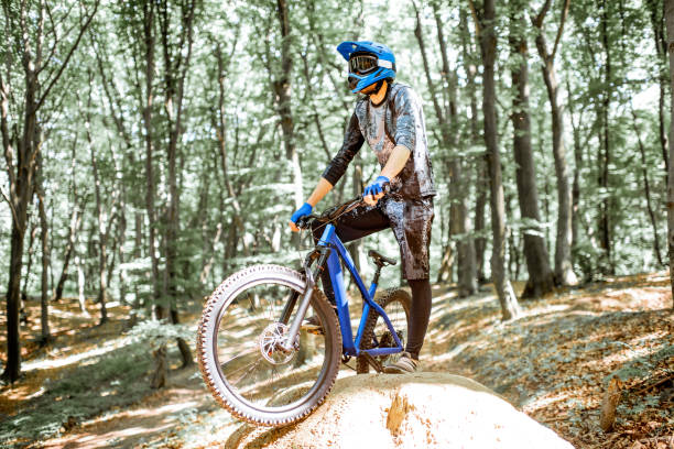 istock Professional cyclist riding in the forest 1155873333