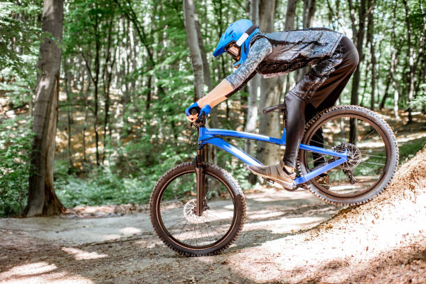 istock Cyclist riding extremely in the forest 1155873334