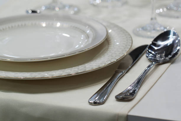 istock plates, cutlery and glasses on the festive table 1155873782
