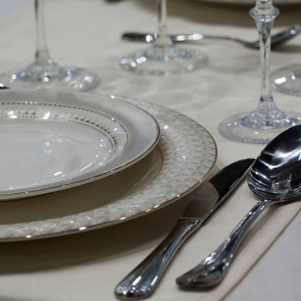 istock plates, cutlery and glasses on the festive table 1155873788