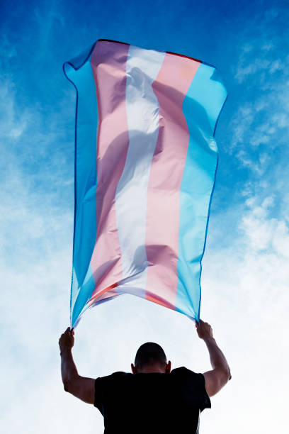 istock young person with a transgender pride flag 1155873914
