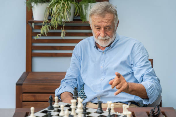 istock Elderly playing chess in nursing home for leisure 1155876325