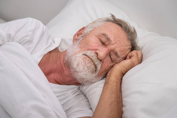 istock Senior elderly man on white bed, sleep with worry,  in bedroom 1155876366