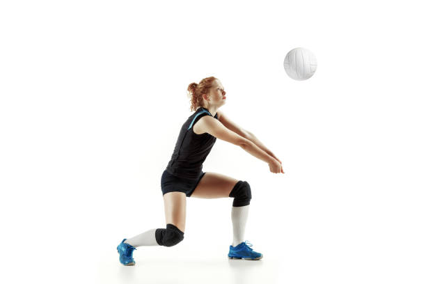 istock Young female volleyball player isolated on white studio background 1155878380