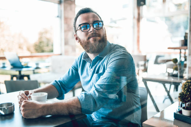 Male Hipster Looking To Order In Coffee Bar