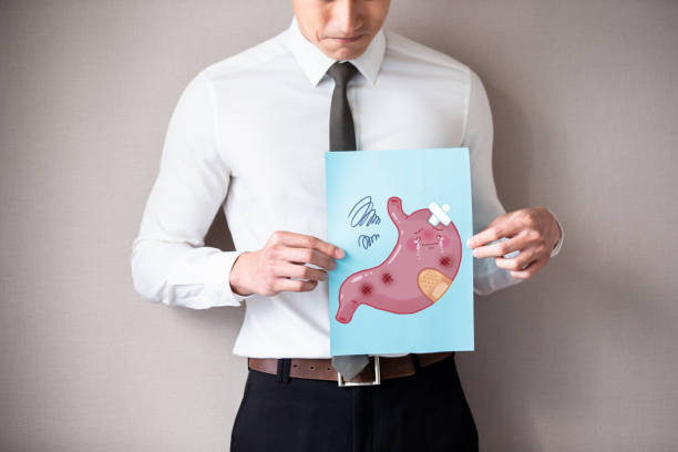 istock businessman with unhealthy stomach 1155880933