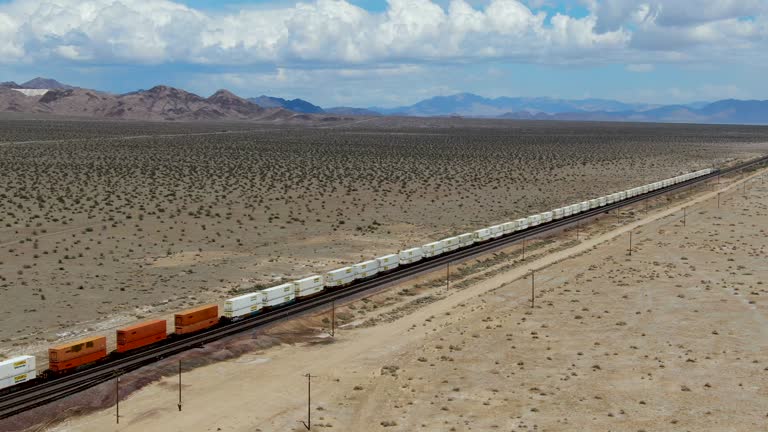 Cargo locomotive railroad engine crossing Arizona desert wilderness