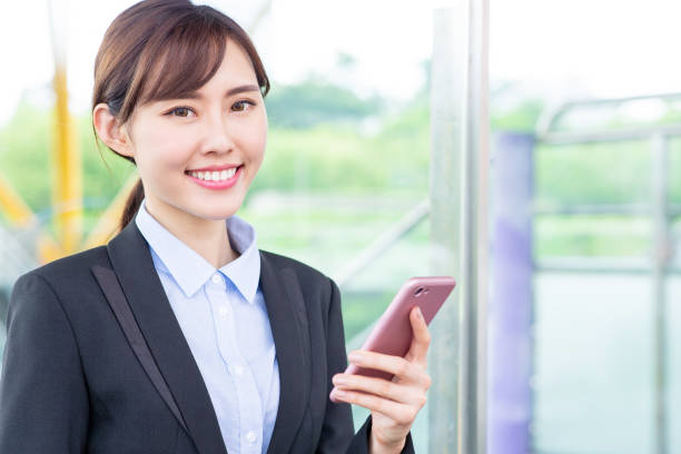 istock Businesswoman use smartphone 1155882413