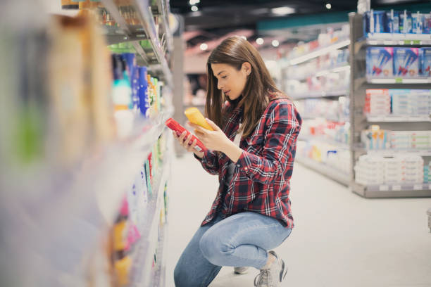 istock Woman choosing sunscreen lotion 1155886169