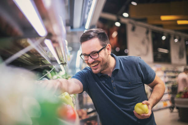 istock man buying vegetables at the market 1155886172