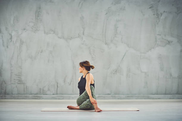 istock Woman doing yoga. 1155887541