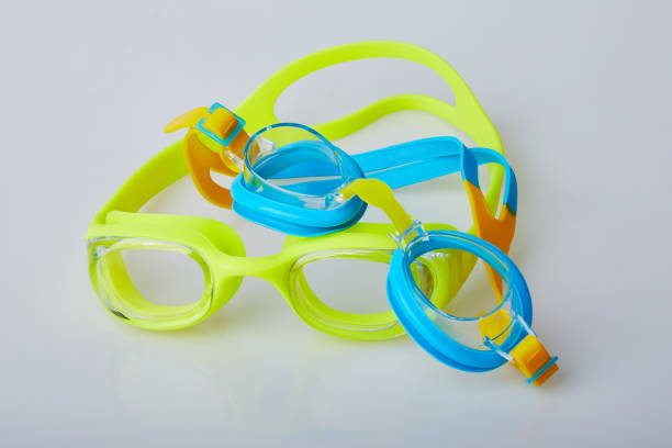 istock Kid's and adult pool goggles. 1155890419