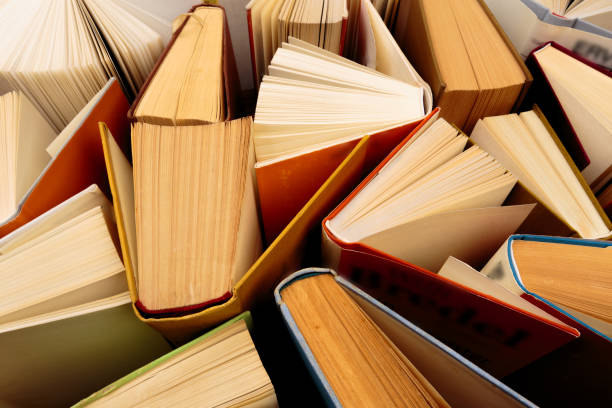 istock Old and used hardback books  top view - Image 1155895394