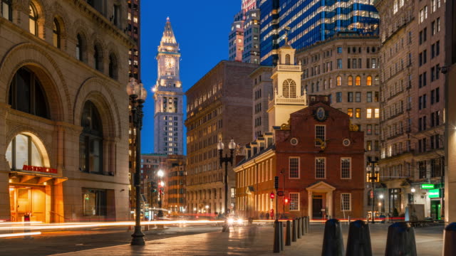 4K Time lapse of crowned people and traffic in front area of Boston old state house at the twilight time, Massachusetts, USA downtown skyline, Architecture and building with tourist concept