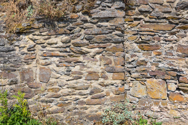 istock Stones background and texture of medieval castle wall 1155899402
