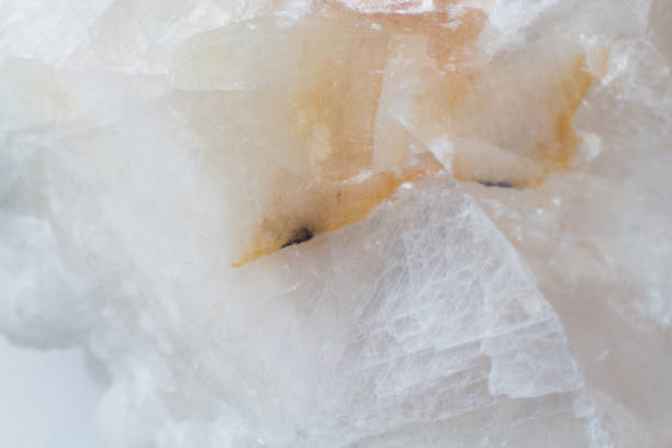 istock Texture of natural untreated white calcite close up 1155899411