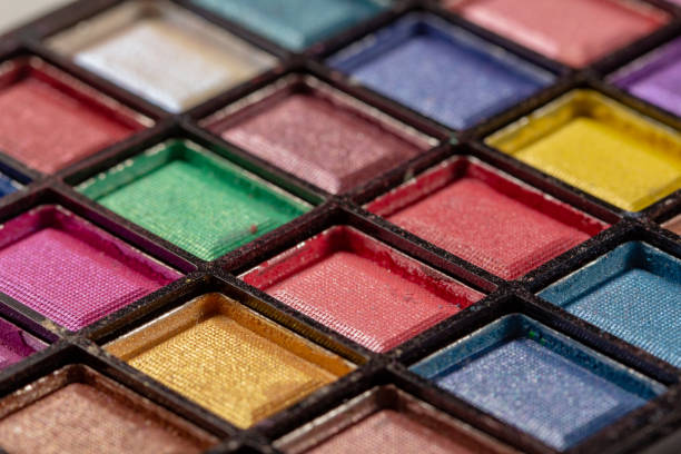 istock Colorful eye shadows palette. Makeup background. close up 1155900750