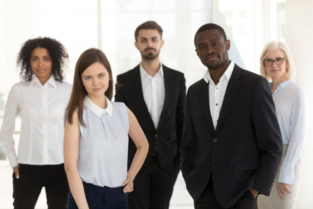 istock Portrait of diverse confident work team looking at camera 1155902284