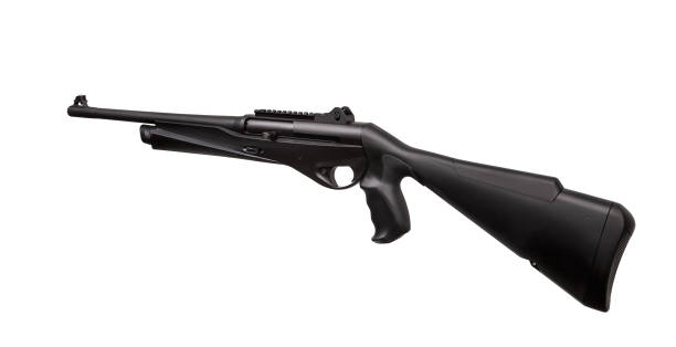 istock Modern black shotgun isolate on white background. Black semi-automatic shotgun on a light background. 1155903130