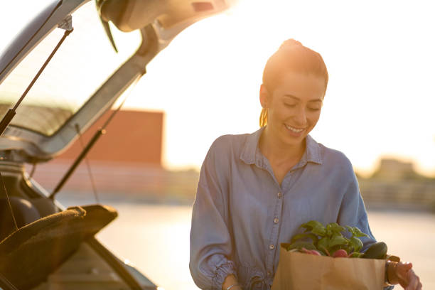 istock Happy girl packing groceries 1155903206