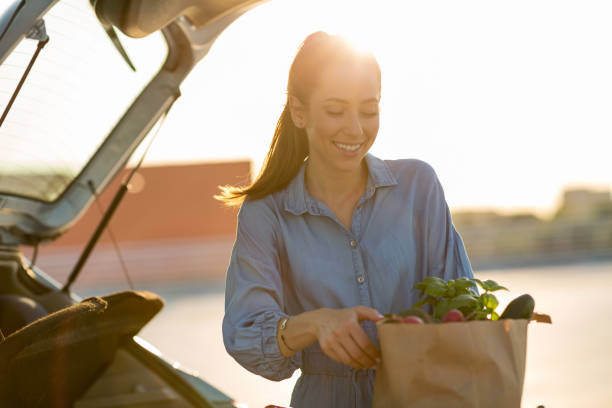 istock Happy girl packing groceries 1155903209