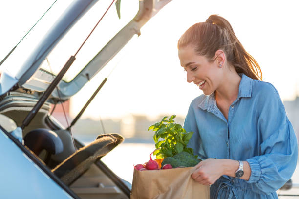 istock Happy girl packing groceries 1155903222