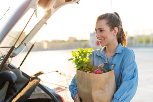 istock Happy girl packing groceries 1155903246