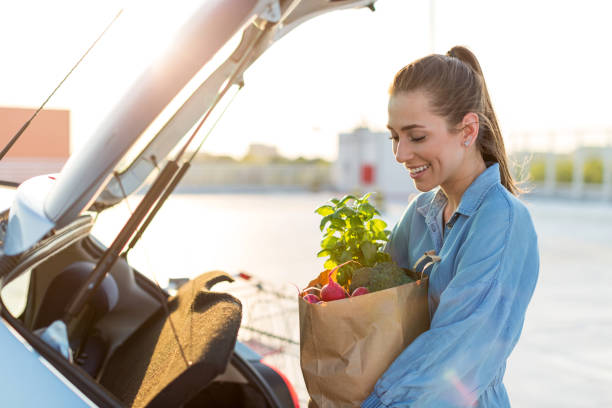 istock Happy girl packing groceries 1155903248