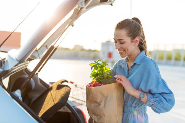 istock Happy girl packing groceries 1155903284