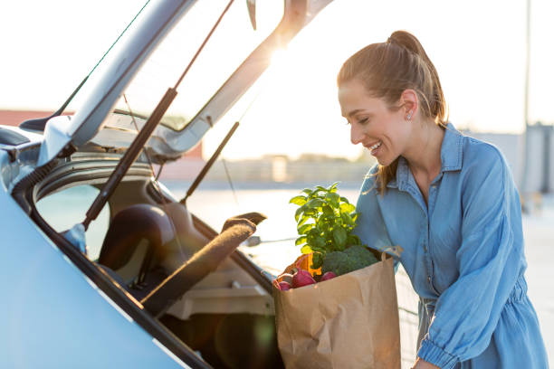 istock Happy girl packing groceries 1155903328