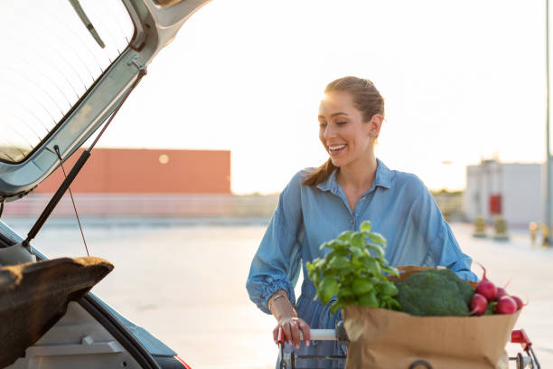 istock Happy girl packing groceries 1155903342