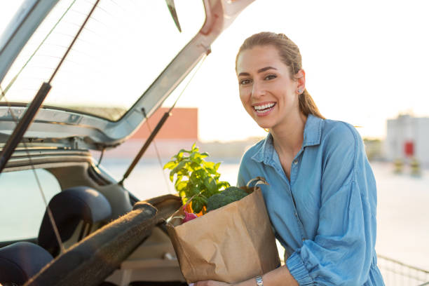 istock Happy girl packing groceries 1155903413