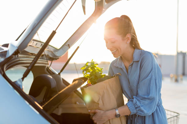 istock Happy girl packing groceries 1155903418