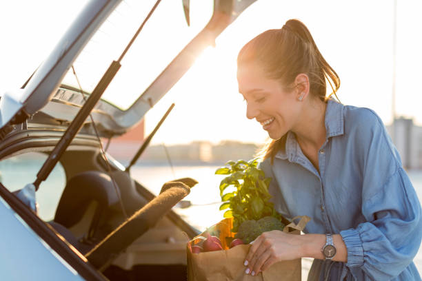 istock Happy girl packing groceries 1155903436