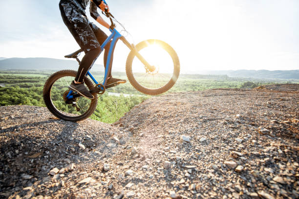 istock Cyclist riding on the rocky mountains 1155903550