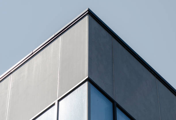 istock corner of a gray concrete building with windows 1155907294