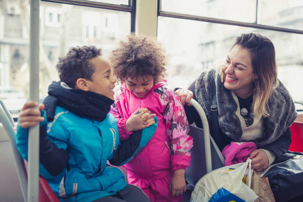 Single mother and her children in public transportation