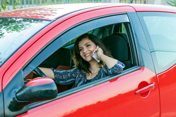 istock Beautiful Woman in the Car 1155908733