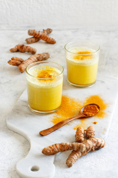 istock Golden milk with turmeric powder 1155910115