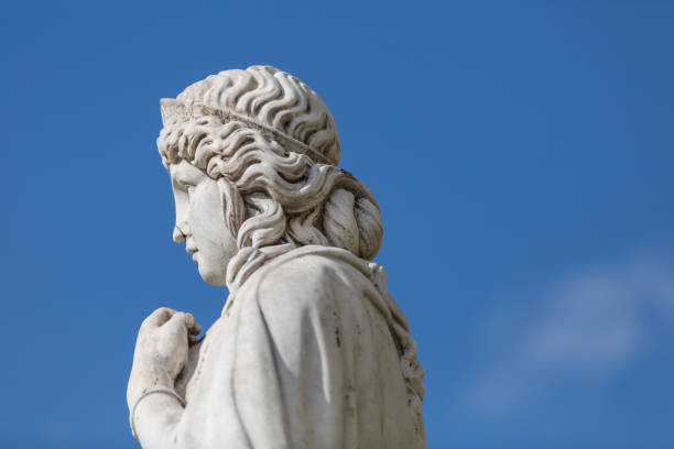istock Statue of lady at cemetery 1155910278