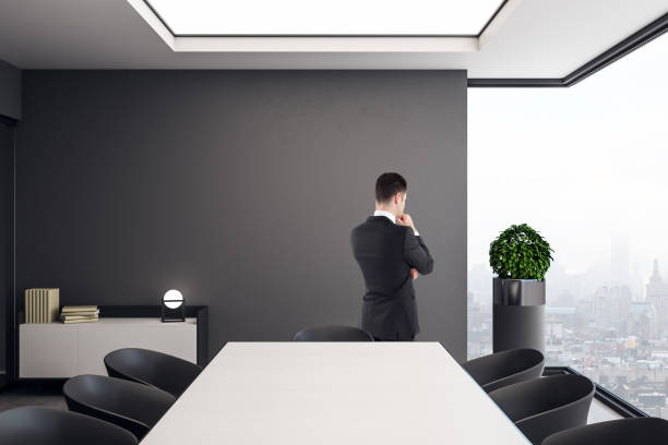 istock Young businessman in meeting room 1155911042