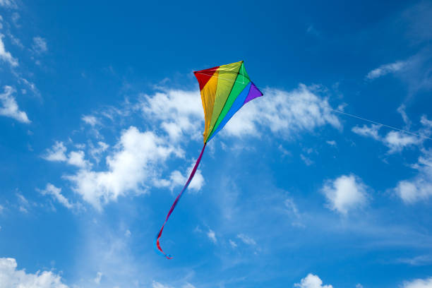 istock Kite flying in the sky among the clouds 1155911275