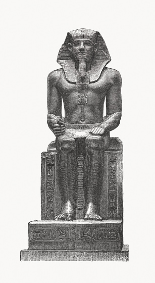 Sitting statue attributed to Amenemhat II, later usurped by 19th Dynasty pharaohs. He was the third pharaoh of the 12th Dynasty of Ancient Egypt (ca. 1919 - 1885 BC). Wood engraving after an ancient colossal statue in the Pergamon Museum, Berlin, Germany, published in 1879.