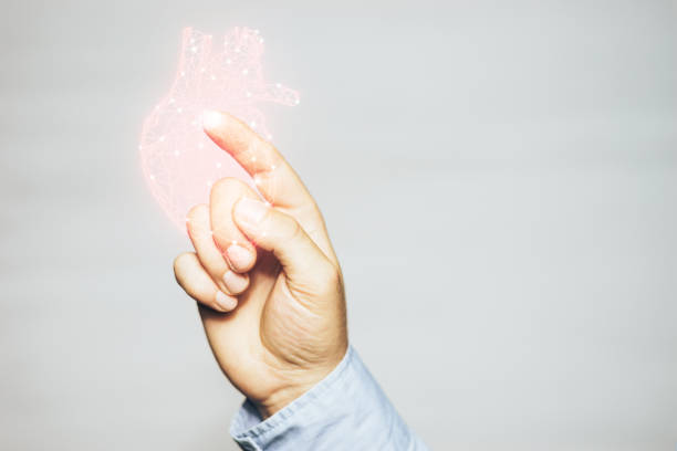istock Human forefinger touches red heart innovative technologies on a white background. Mixed media. 1155912183