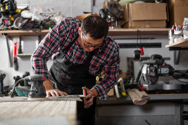 istock male craftsman work in the workshop 1155912698