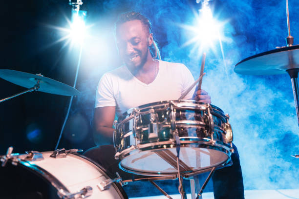 istock Young african-american jazz musician playing drums 1155913131