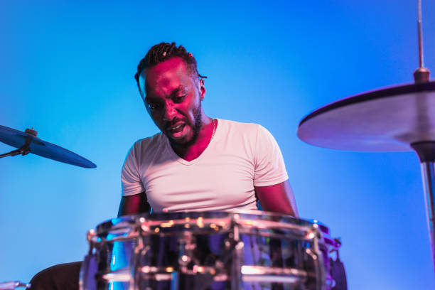 istock Young african-american jazz musician playing drums 1155913137