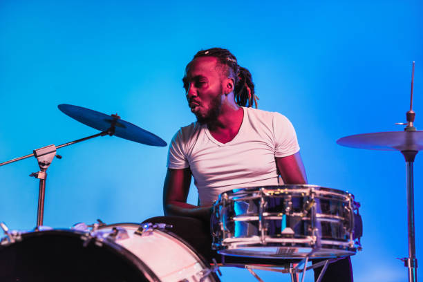 istock Young african-american jazz musician playing drums 1155913141