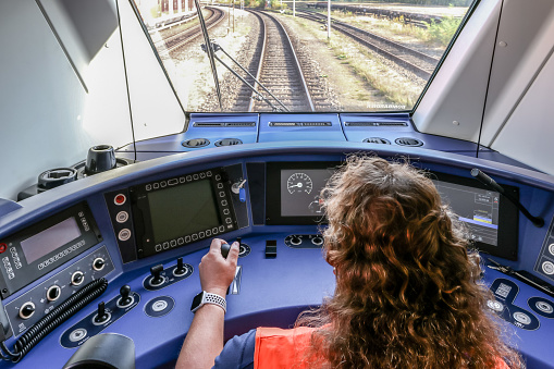 Hennigsgdorf, Germany, September 20, 2018 - Engine driver in the cab of a new battery train of the manufacturer Bombardier Transportation.