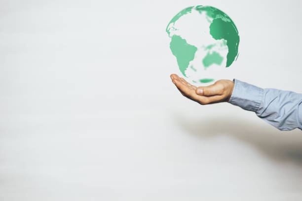 istock Protect our world in human hands and nebula dust. Mixed media. 1155913325